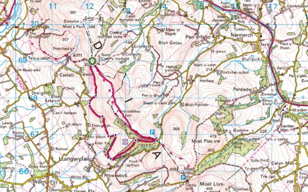 A detailed map showing hiking routes and car parks around Penycloddiau Hill Fort in the Clwydian Range, North Wales.