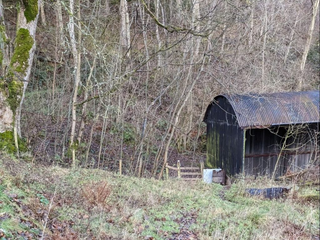 The style is to the left of this barn
