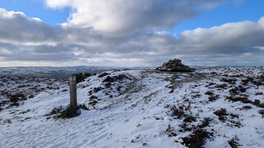 the summit of Moel y Parc - a cairn and waymarker